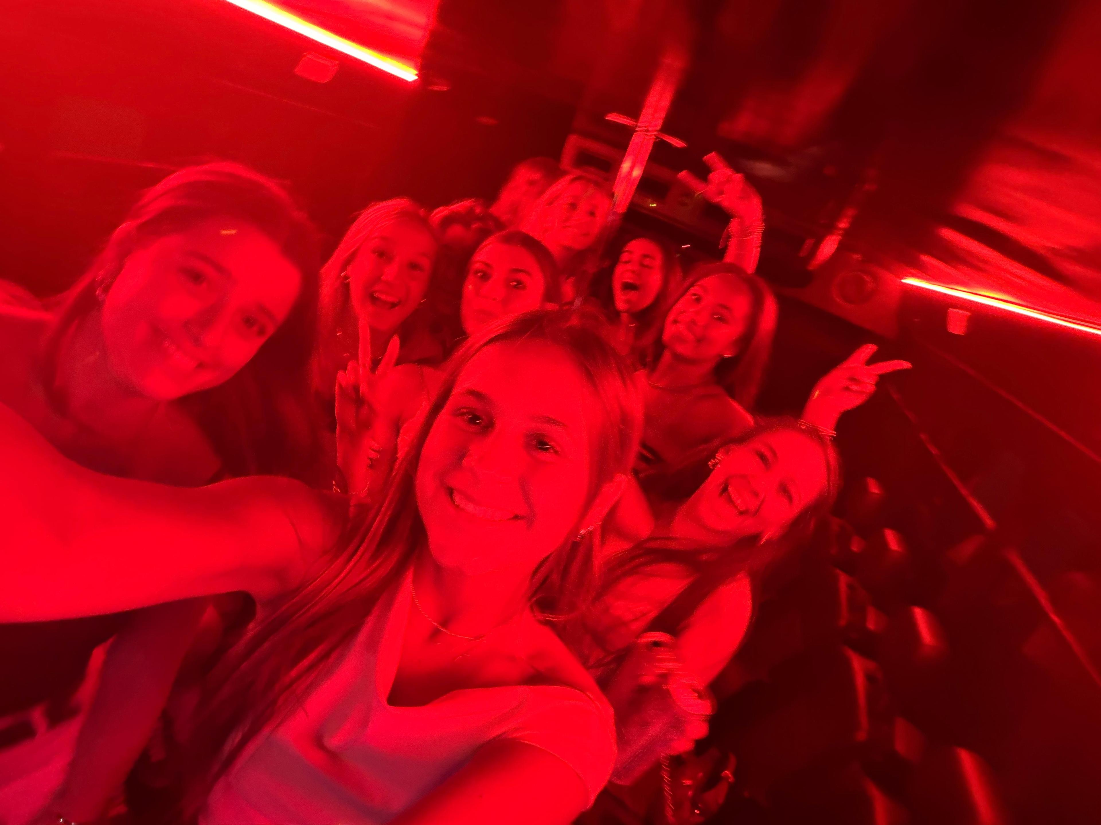 Riders taking a selfie on an AUX party bus