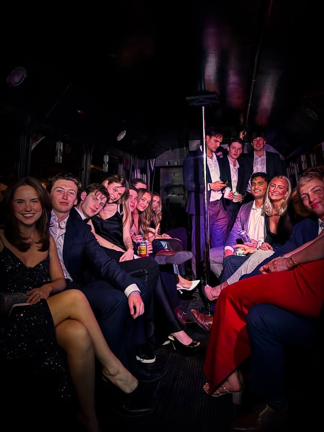 Friends celebrating bachelorette party in luxury vehicle