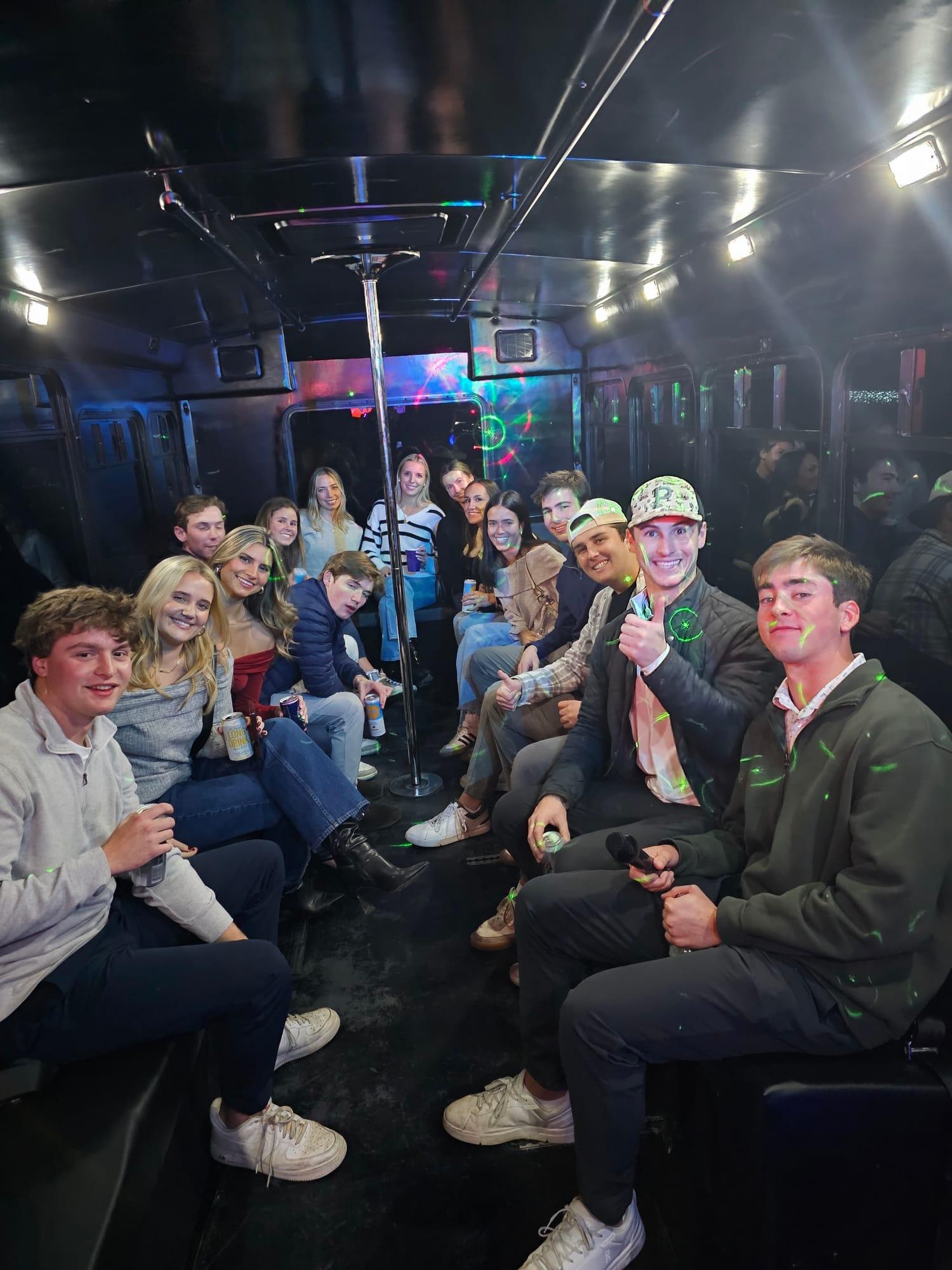 Large group riding on an AUX party bus