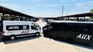 AuxRideshare-Owner-with-Party-Bus-Morning-View
